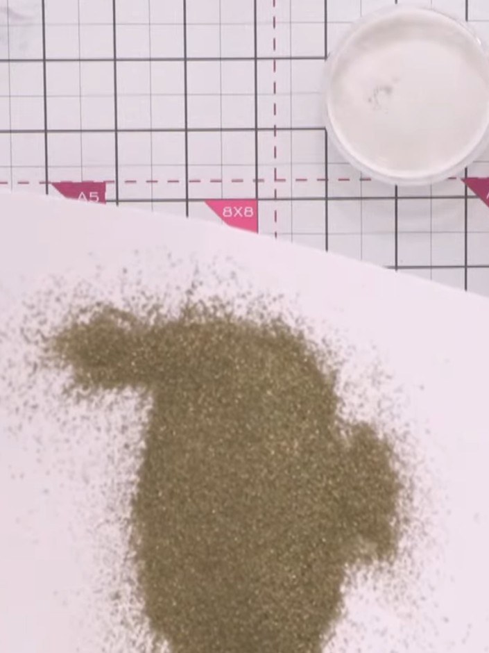 Step 12: Apply sticky embossing ink to your design again and repeat the layering process with the metallic powders if d
