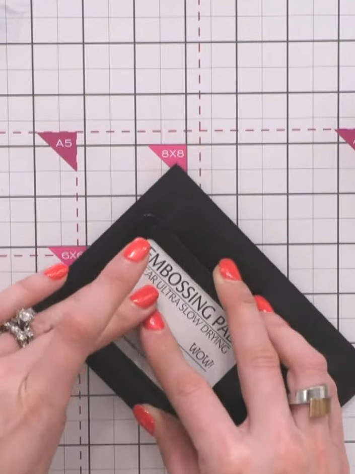 Step 2: Apply WOW embossing ink pad to the black cardstock, covering the surface evenly to create a sticky layer for t