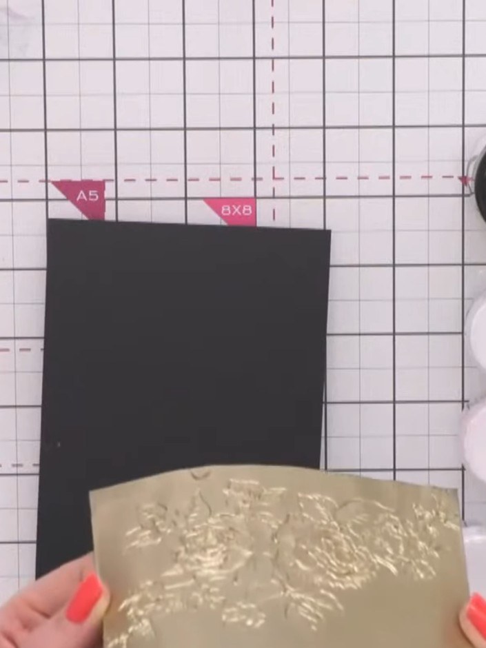 Step 4: Heat set the gold powder on the cardstock using a heat gun, moving it evenly over the surface until the powder