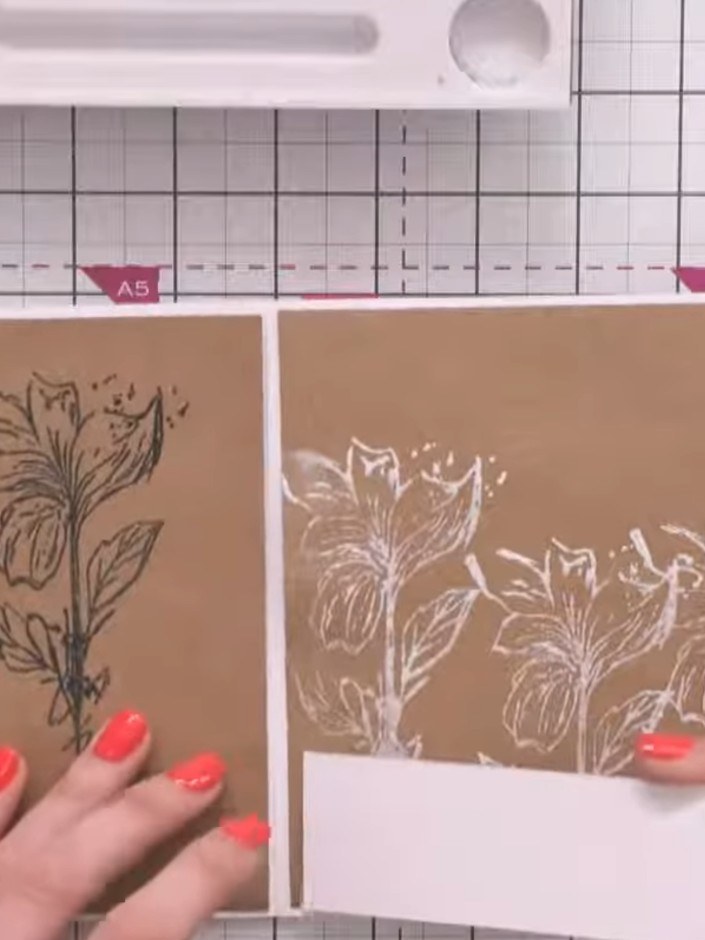 Step 12: Take the white card panels and adhere them to the side edges of the kraft panels with the black-stamped flower