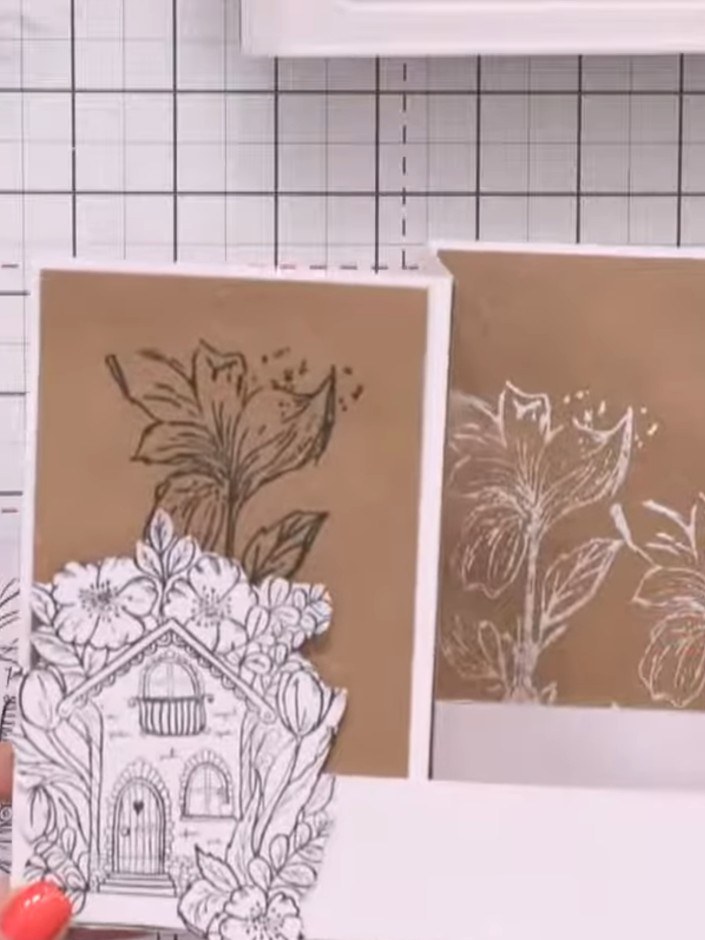 Step 13: Arrange the pre-cut house stamp images on the central panel to create a housing estate scene. Position the sta