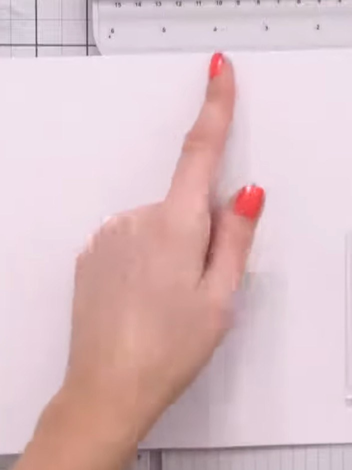 Step 2: Score the front of the card at the 4-inch mark using a scoring tool. The card should fold back as it did previ