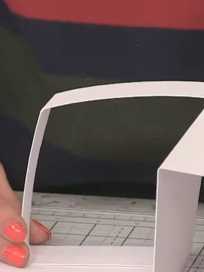 Step 6: Glue the remaining part of the white strip to the base to create a square structure that folds inside the card