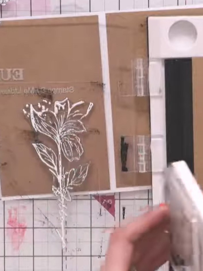 Step 8: Stamp the floral image from the Happy Home stamp set in white ink onto the back panel of kraft cardstock to cr