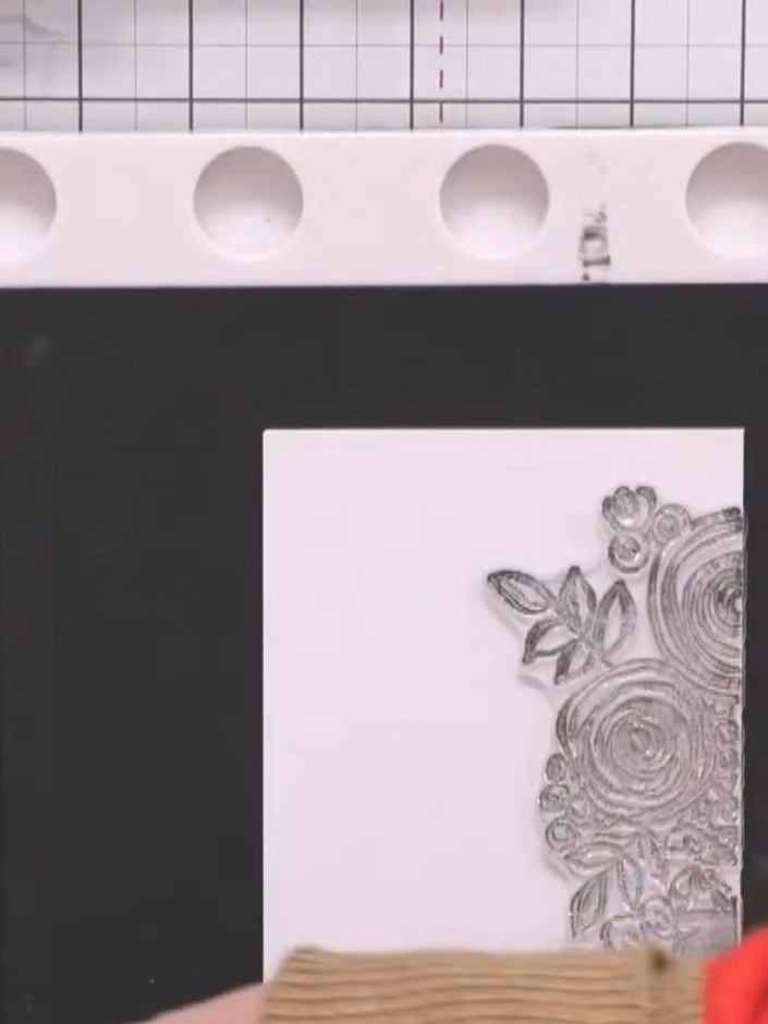 Step 12: Stamp a floral image onto white cardstock using black ink. Fussy-cut around the stamped design to create a dec