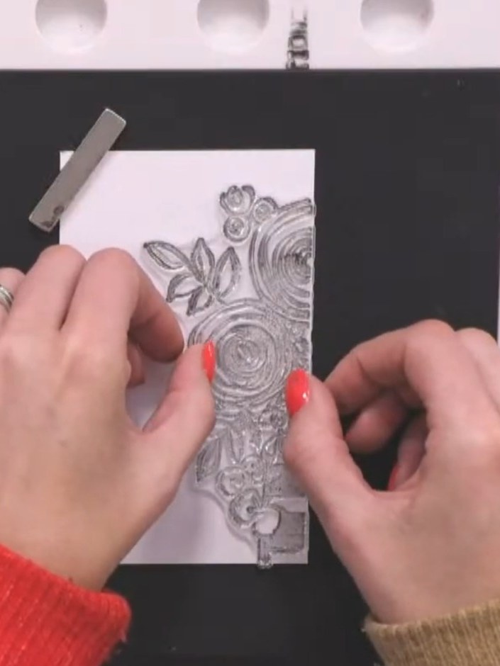 Step 4: Stamp the same floral design onto a second white panel in the same position as the first, ensuring the placeme