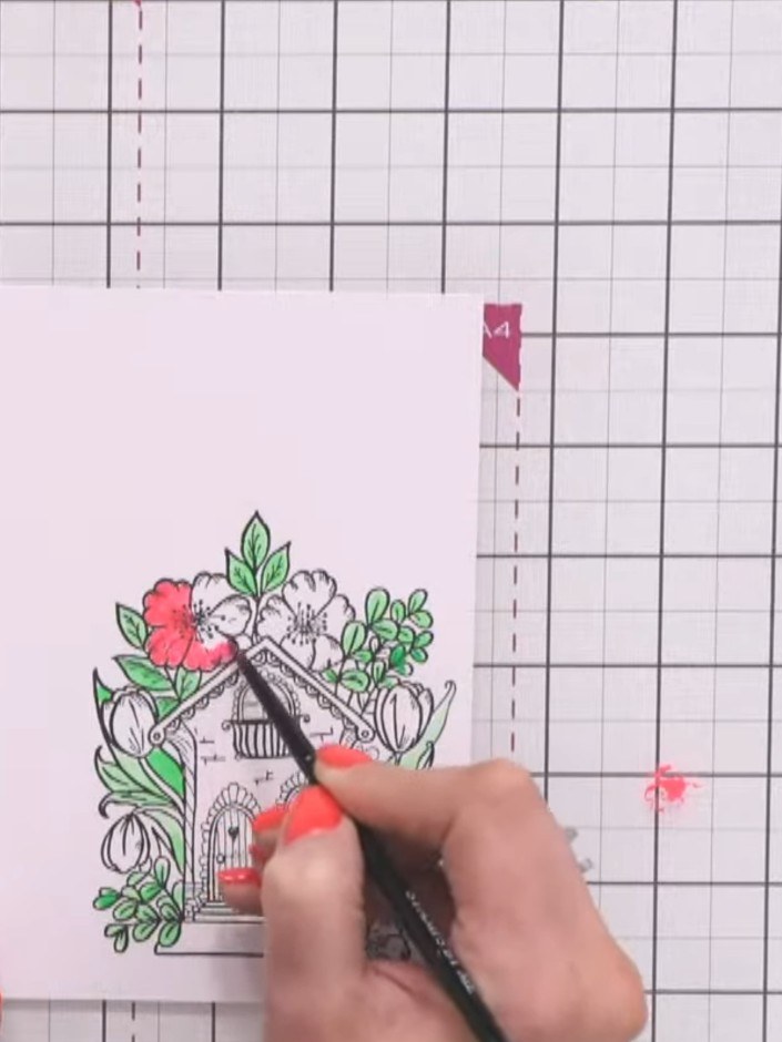 Step 4: Using the neon pink and orange watercolours from your palette, paint the remaining flowers on the stamped imag
