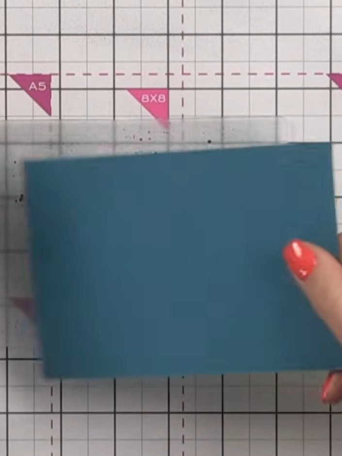 Step 3: Place the misted cardstock into the embossing folder, ensuring the wet side faces the embossing design. Press 
