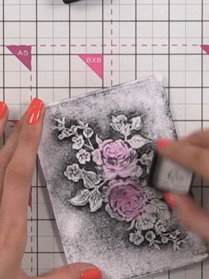 Step 4: Use the same ink pad to build up colour around the edges of the embossed image, pressing harder around the per