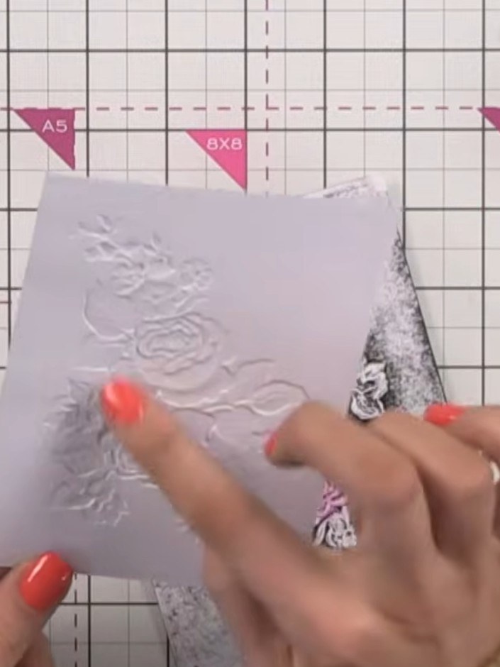 Step 5: Create a halo effect around the embossed floral image by applying darker ink around the border of the design. 