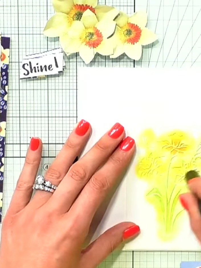 Step 4: Using darker green pigment ink, add shading to the stems and leaves to create depth and dimension. Apply the i