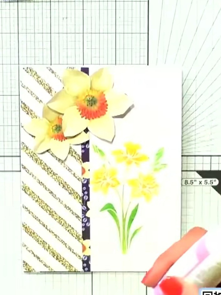 Step 6: Mat and layer the stencilled piece onto a piece of the patterned paper featuring the gold diagonal stripes and