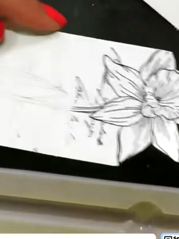 Step 5: Stamp just the daffodil head in the centre of the white panel to create a focal point. Use the sketched floral