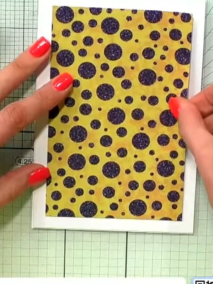 Step 7: Layer the matted white piece with the stamped floral image onto the yellow patterned paper piece with purple p