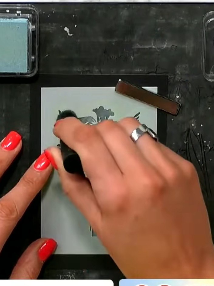 Step 2: Position the stencil over the stamped floral image on the black card. Using a sponge dauber, apply yellow pigm