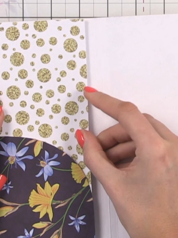 Step 14: Adhere the decorated inner cover panel with the gold glitter dots pattern to the inside front cover, positioni