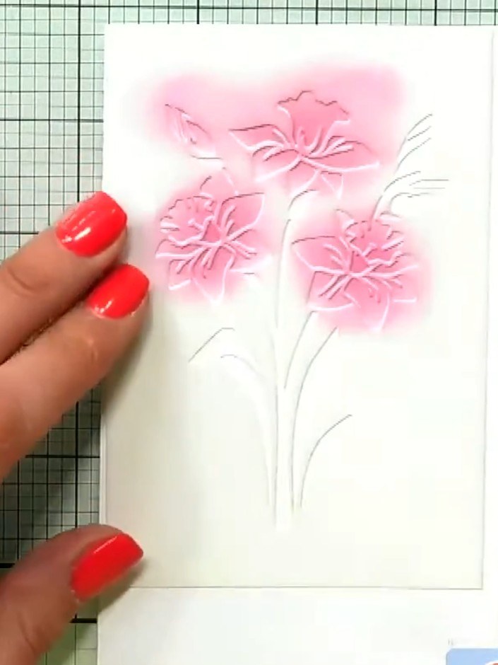 Step 4: Adhere the torn pink paper strip down the centre of the card front, positioning it to overlap the stencilled f