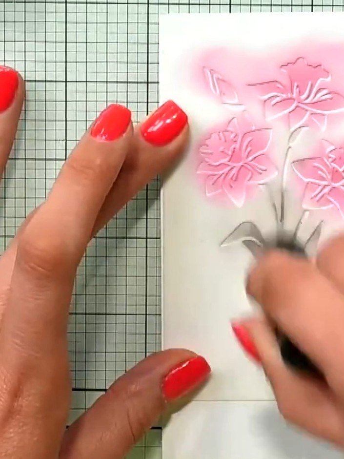 Step 5: Stamp the daffodil detail from the A5 stamp set in black ink onto white cardstock, positioning the flowers so 