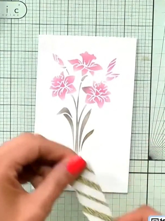 Step 6: Use foam pads to adhere all the layers together, building up dimension on your card. Secure the stencilled flo
