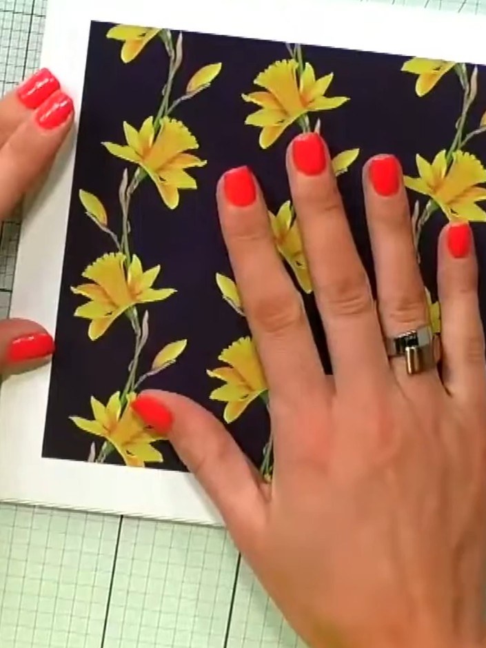 Step 2: Select patterned paper from your paper pad with designs that have flat edges suitable for creating a wreath bo