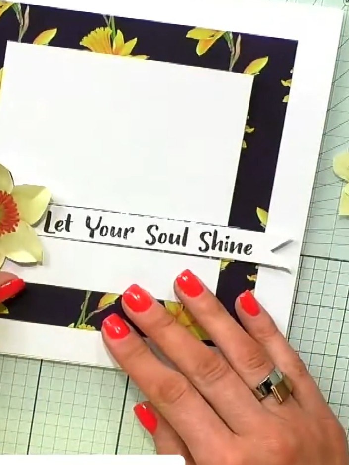 Step 6: Position the fussy-cut daffodils onto the card, arranging them to create a balanced design. Keep the layout cl