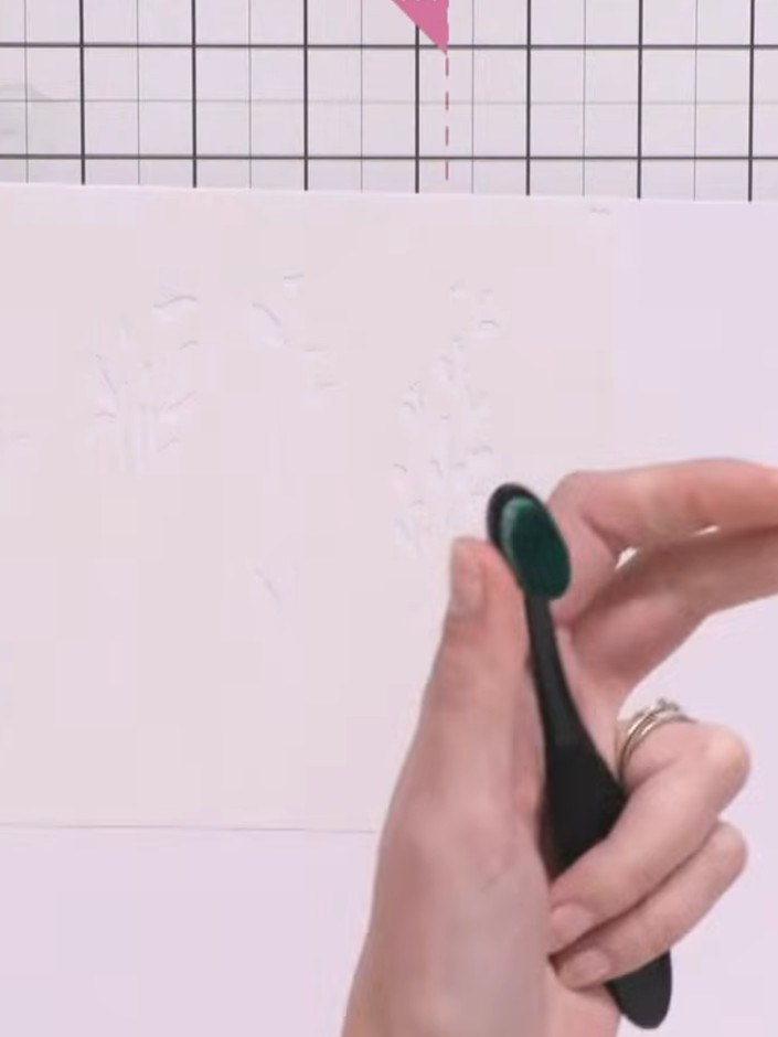 Step 1: Position the first layering stencil (numbered 1) on your white card blank. Apply green ink through the stencil
