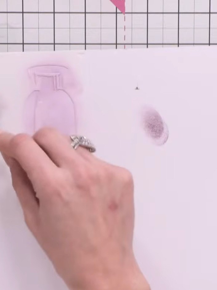 Step 6: Position the second vase stencil over the first layer and apply ink using a blending tool, pressing slightly h