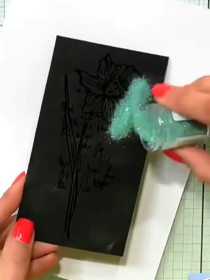 Step 2: Stamp the daffodil image from the Sketched Florals A5 stamp set onto black card using pigment ink. Press firml