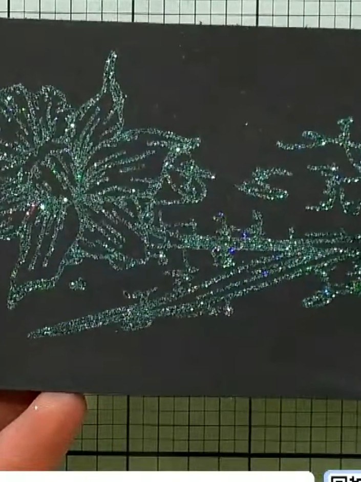 Step 6: Heat-set the embossing powder using an embossing heat gun, moving it over the design until the powder is fully