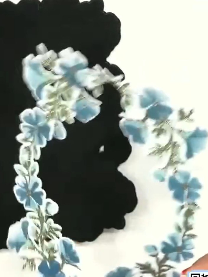 Step 7: Pop out the die-cut floral elements from the design. Position and arrange the blue flowers and foliage pieces 