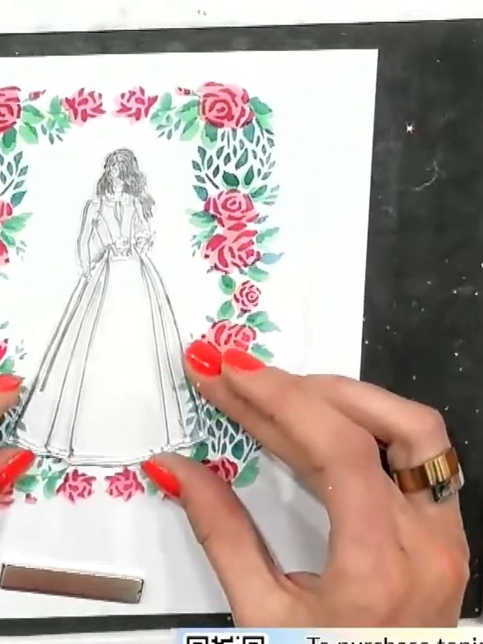 Step 4: Use a heat tool to heat emboss the dress on the card. Move the heat tool over the embossing powder until it me