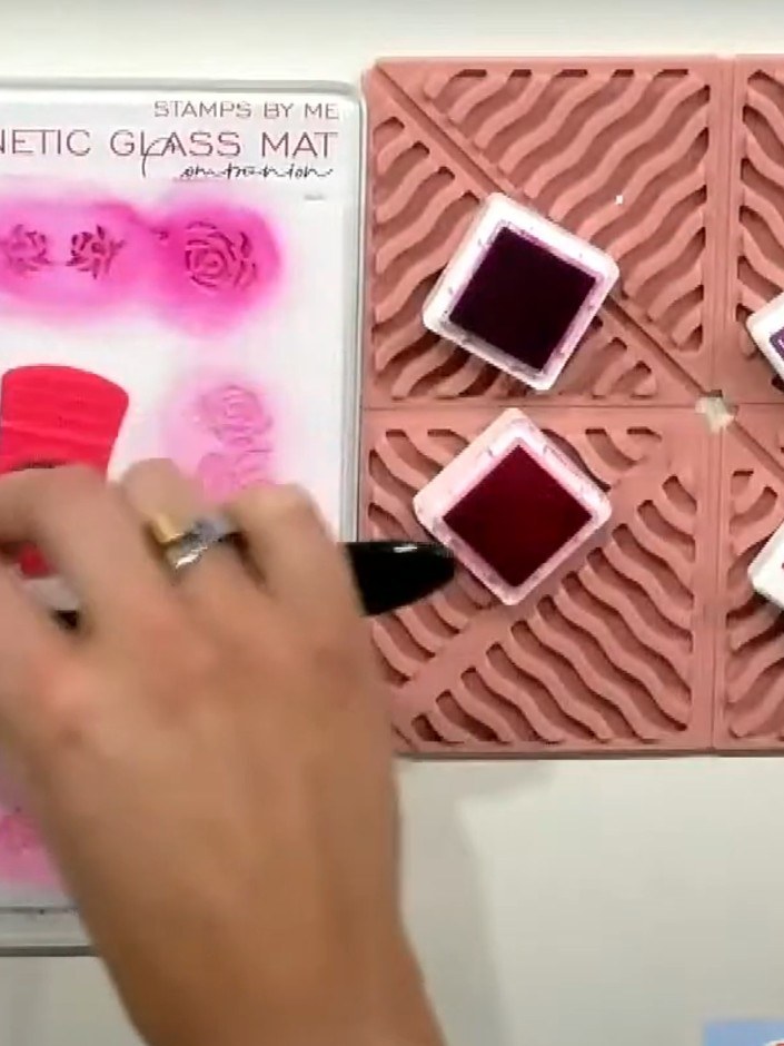 Step 4: Position stencil number three over your design on the magnetic glass mat. Apply green ink through the stencil 