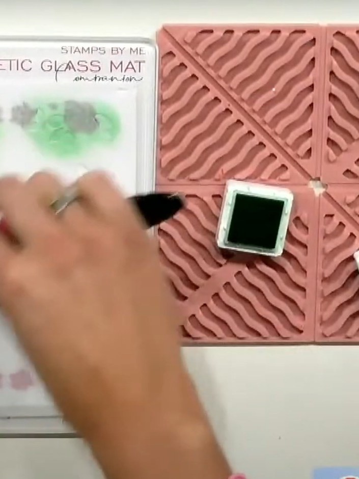Step 5: Apply sparkly paste through stencil number four using a spatula to create the final layer of the floral design