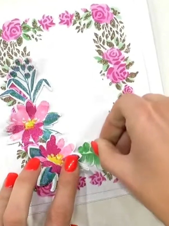 Step 9: Add greenery stamp elements around the flowers using green ink to fill in gaps and complete the floral wreath 