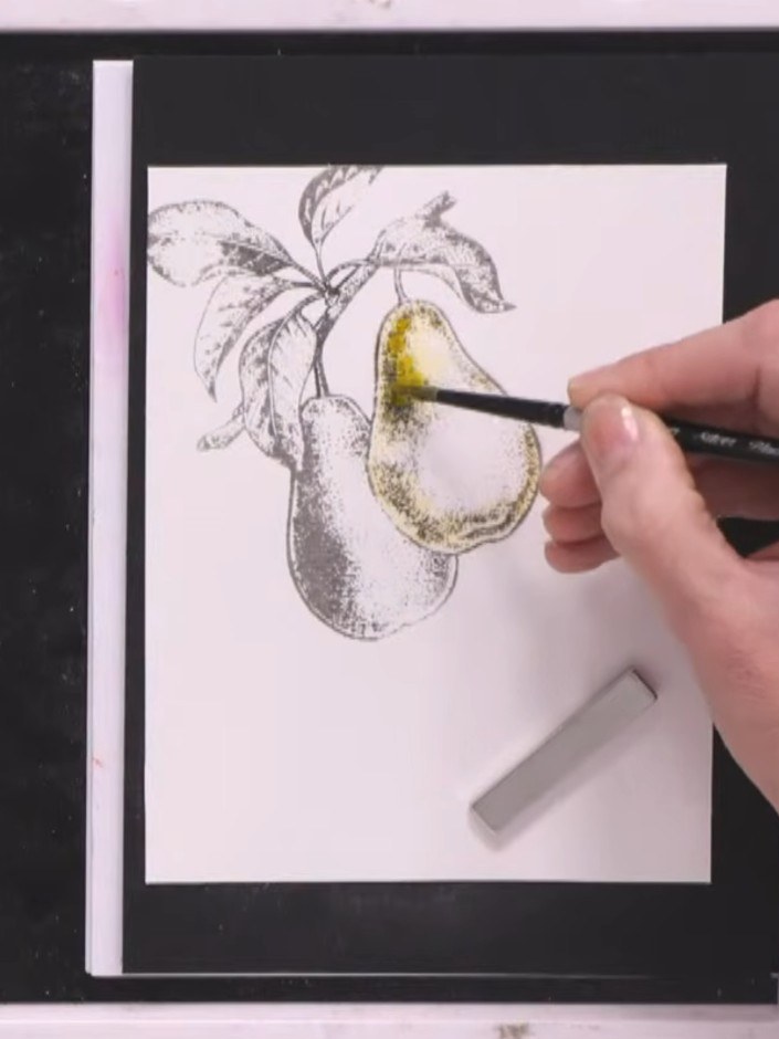 Step 5: Add more orange ink to the pear, blending it with the existing green and yellow tones. Allow the colours to bl
