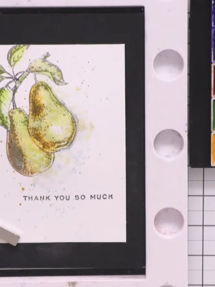 Step 9: Stamp 'THANK YOU SO MUCH' or your chosen sentiment onto the bottom of the painted panel using a black ink pad.
