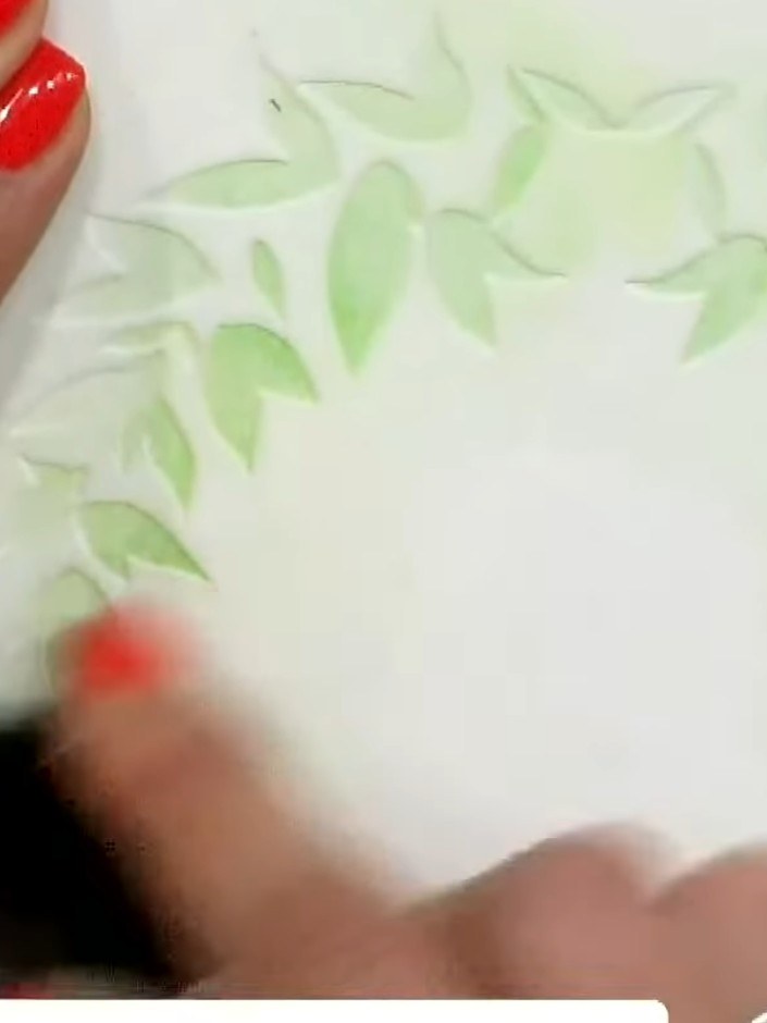 Step 5: Position the third stencil over your card and apply pink ink through the floral elements using a blending tool
