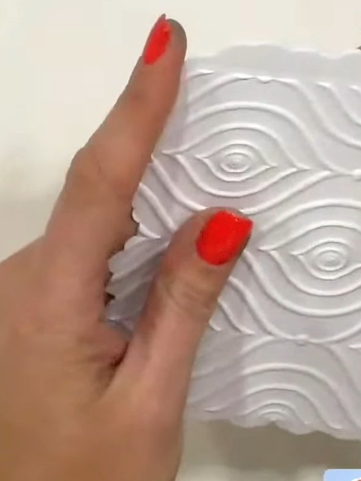 Step 5: Apply adhesive to the back of the embossed white panel and attach it to the front of your shaped card base, en