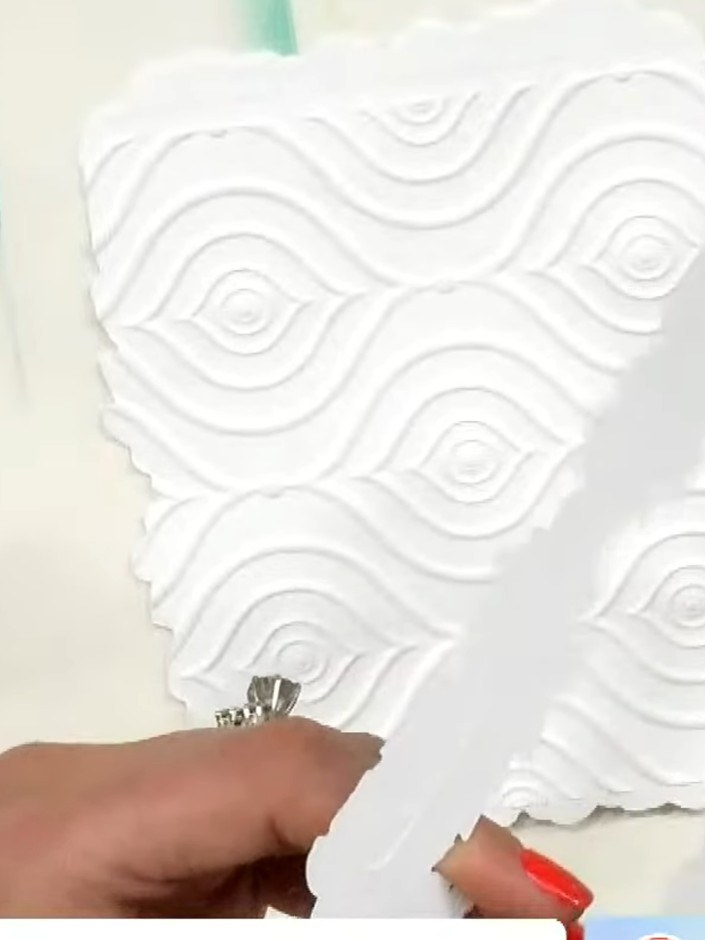 Step 6: Position the layered stencil frame in the centre of your shaped card front, ensuring it is evenly placed withi