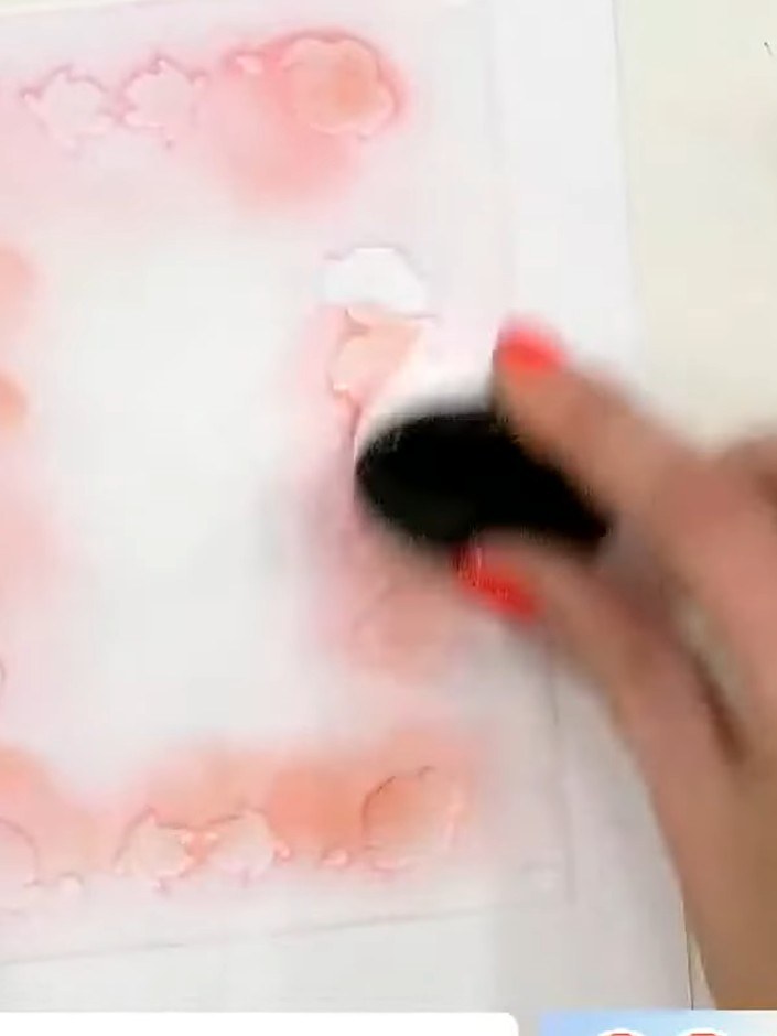 Step 2: Position stencil number two over your work, aligning it using the heart registration guides. Apply a slightly 