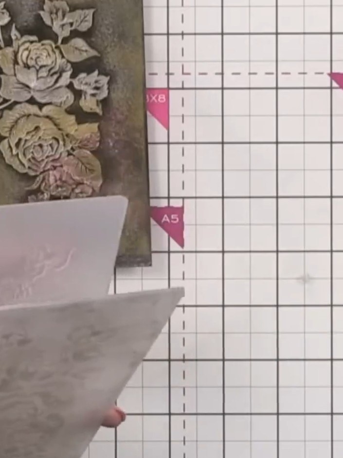 Step 11: Layer the finished embossed background onto white card. This will capture any excess gold transfer and create 