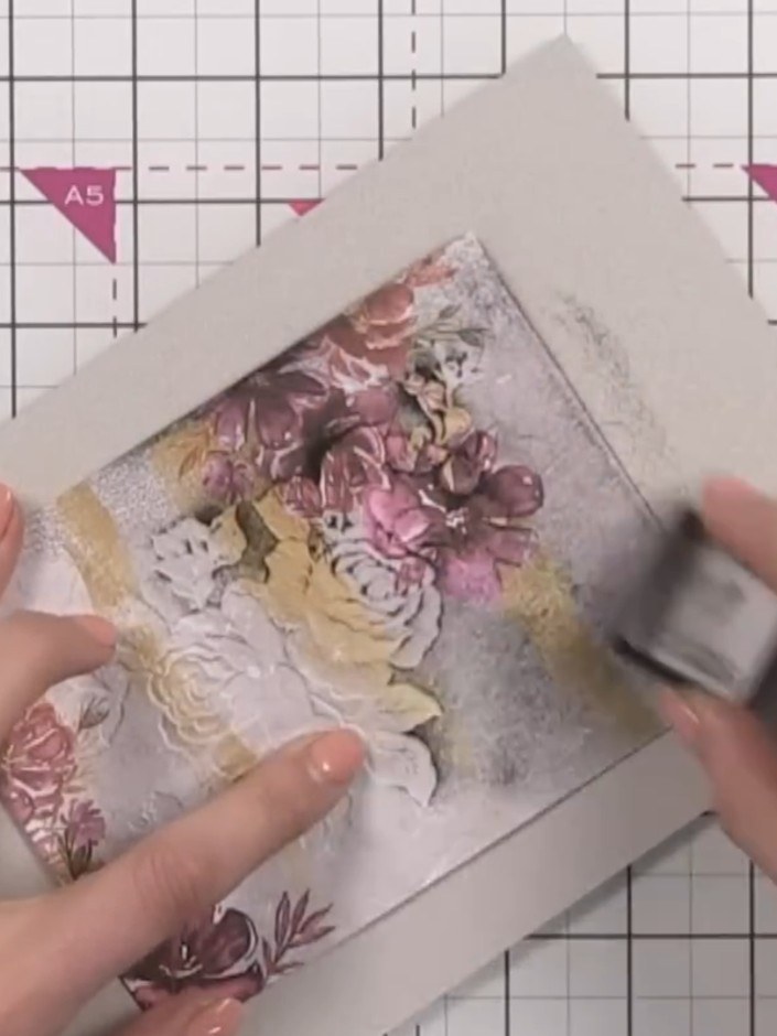 Step 5: Take a black ink pad and burnish it over the exterior of the patterned paper, pushing the ink into the debosse