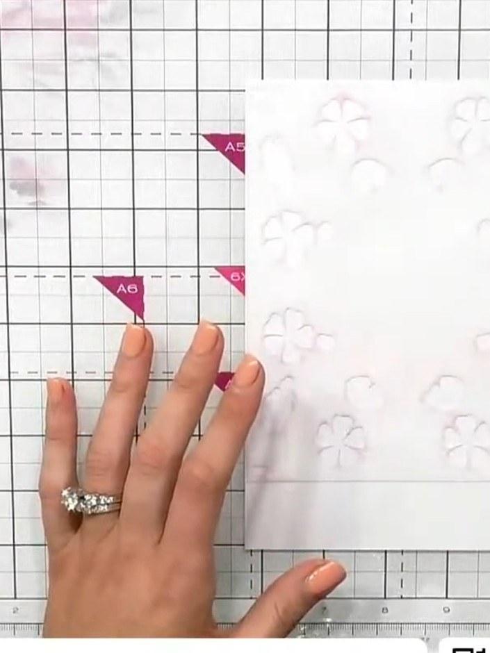 Step 6: Line up the heart registration marks on the stencil with those already stamped. Apply the second layer using o