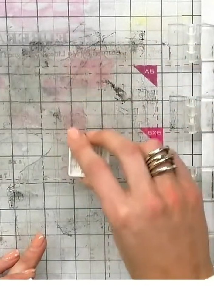 Step 2: Apply the second stencil layer using purple ink, carefully aligning the heart registration marks on the stenci