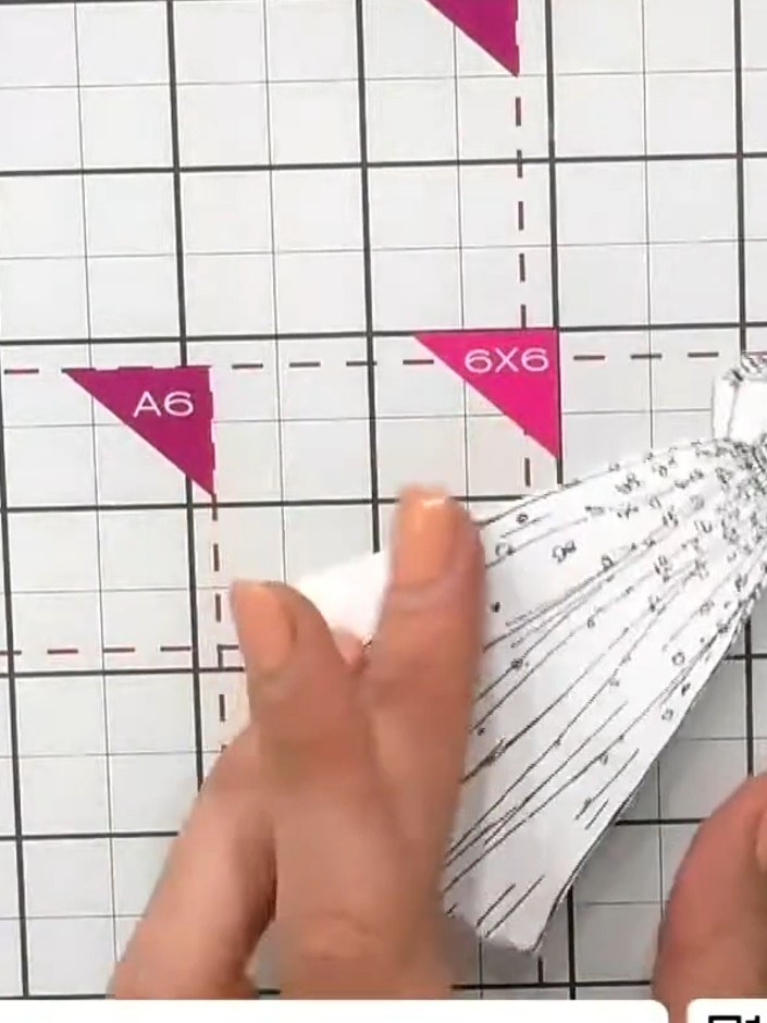 Step 3: Carefully fussy-cut around the stamped dress on the patterned paper, cutting away the excess paper whilst keep
