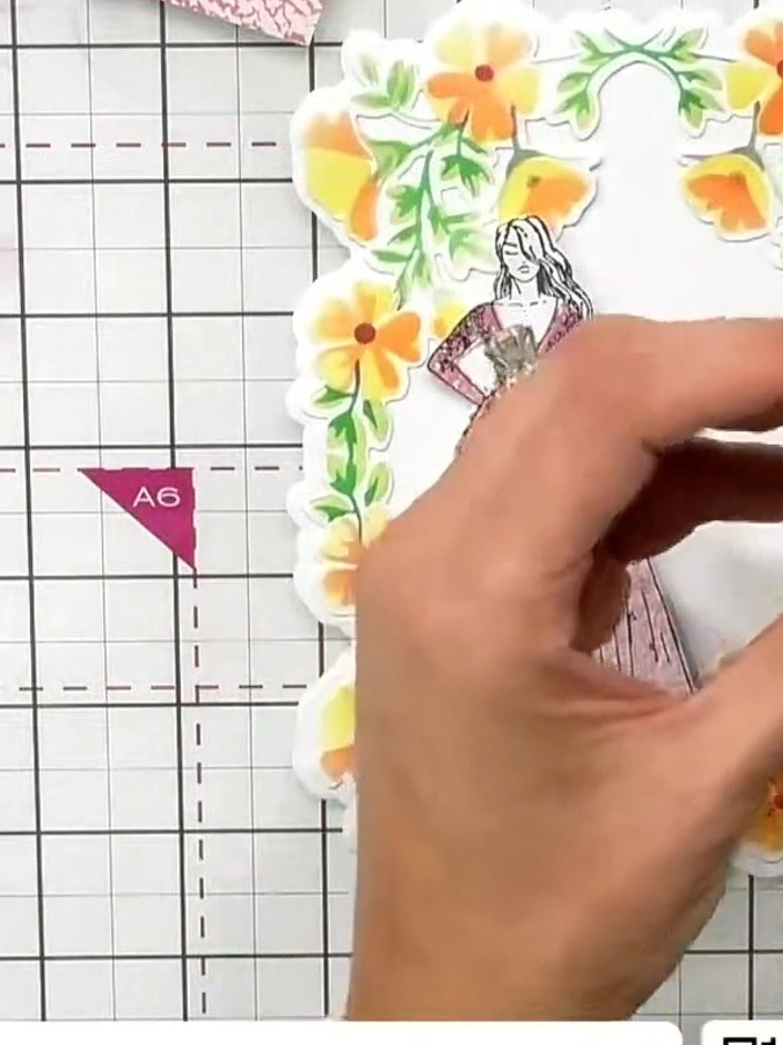 Step 6: Adhere the layered lady stamp onto your card base, positioning her within the dimensional floral frame. Ensure
