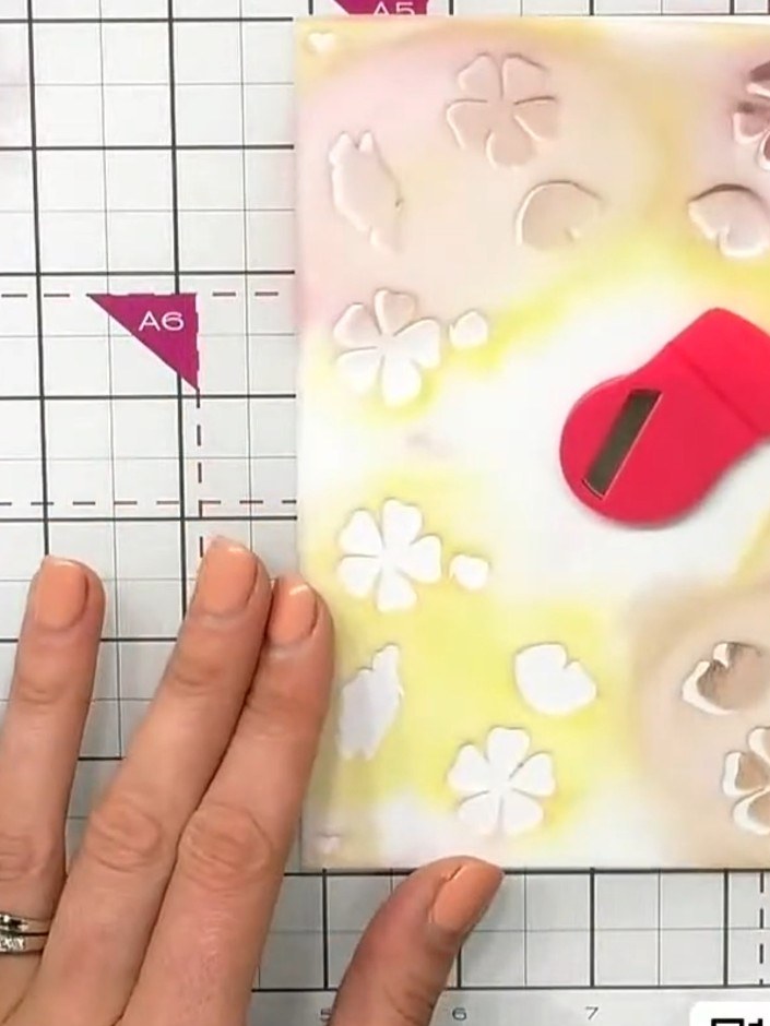 Step 2: Apply a dusky purple or vintage colour through the flower stencil using a blending brush, creating soft floral