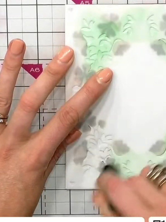 Step 5: Apply the fourth stencil layer using brown ink to add the final floral details to the frame. Blend the colour 