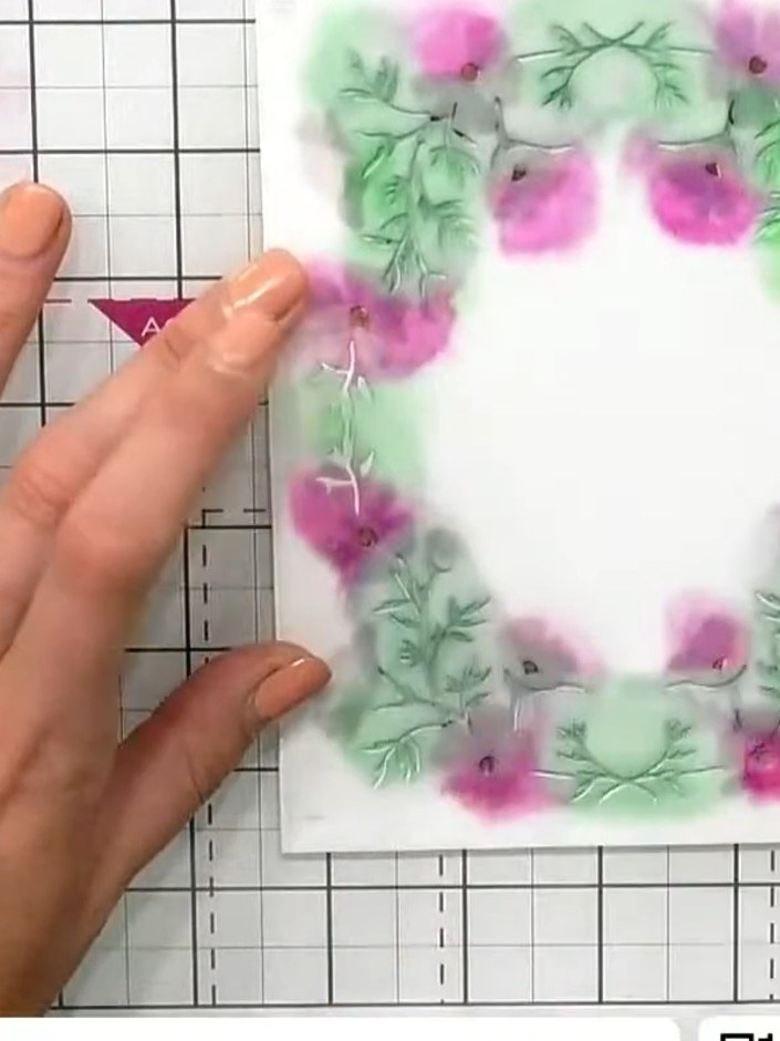 Step 6: Pega el marco floral estarcido sobre una base de cartulina blanca para crear el frente de la tarjeta.