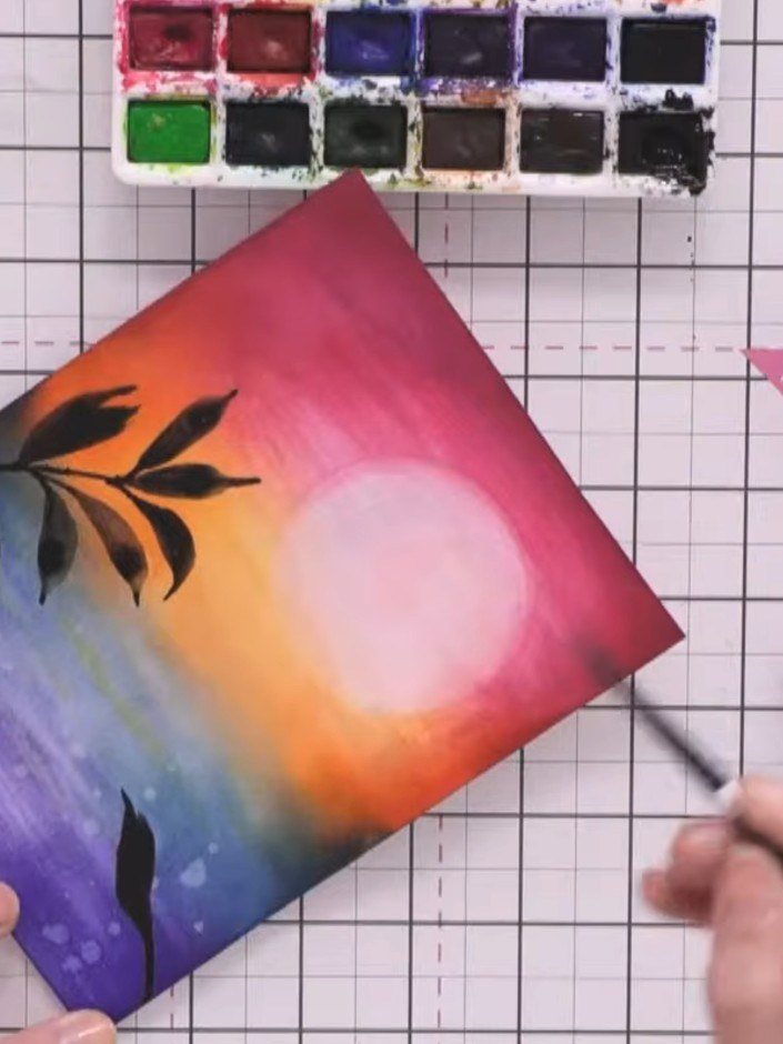 Step 10: Paint additional stems and leaves coming in from the sides of your sunset landscape, varying the sizes. Allow 